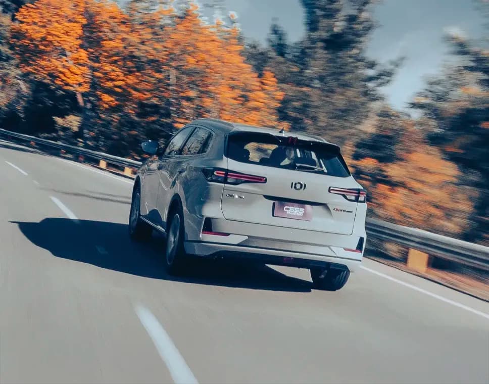 Car on a steep hill, with graphics showing the hill-hold assist preventing it from rolling back.